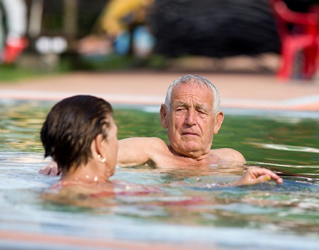 Managing Wealth During Retirement - Couple in Pool