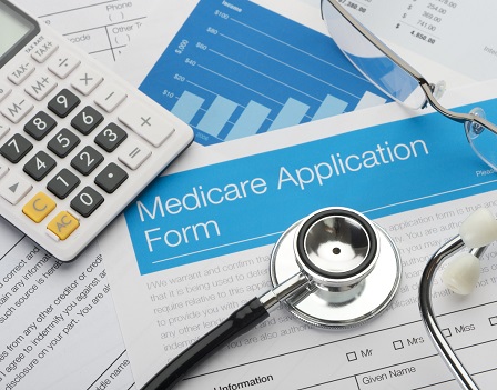 Medicare application form with stethoscope and paperwork