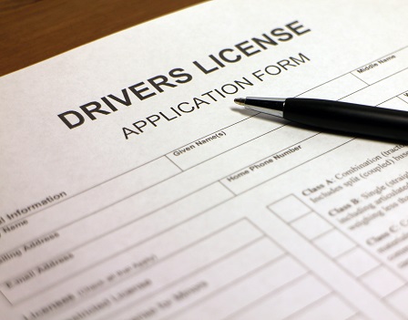 Someone filling out Drivers License Application Form