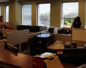 Packing up the computers for their trip upstairs.