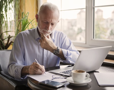 Portrait of senior businessman working at his office