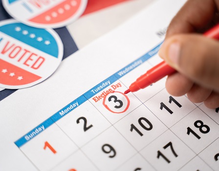 Close up of Hands marking November 3 election day on Calendar as reminder for voting - Concept of reminder for US election